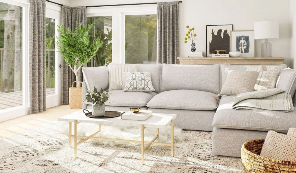 Phòng khách sử dụng bộ sofa chữ L tạo nên bố cục không gian hài hòa