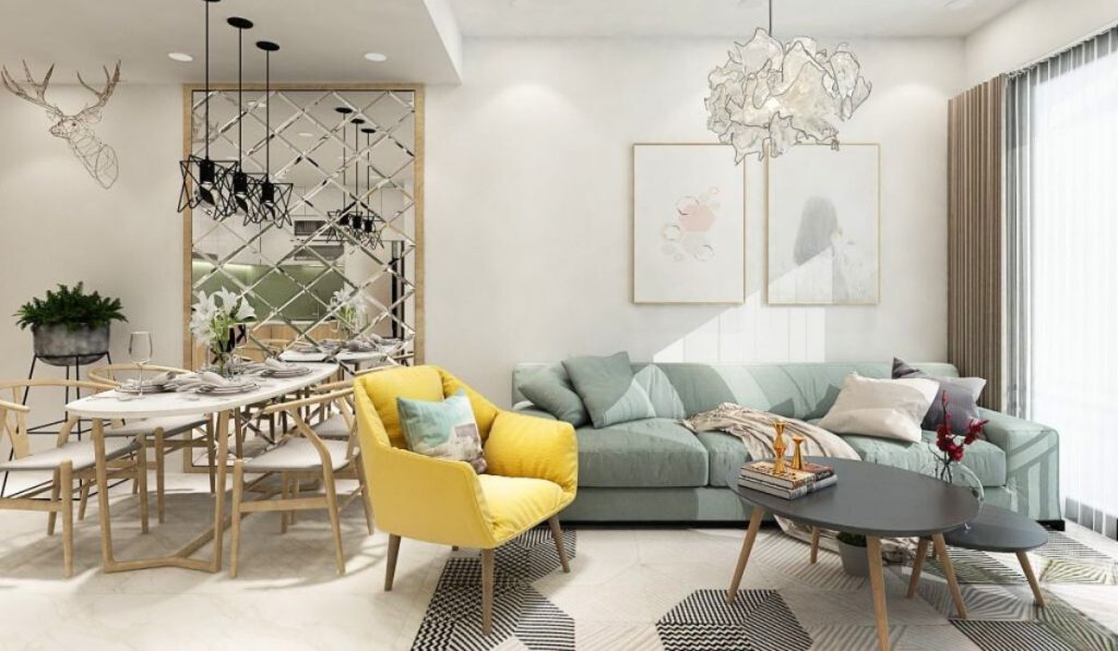 Đèn chùm và tranh nghệ thuật giúp không gian phòng khách đỡ trống trải và đẹp mắt hơn